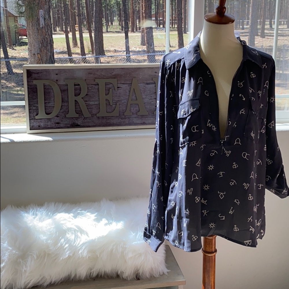 Women's blouse from Cold Cactus Boutique.